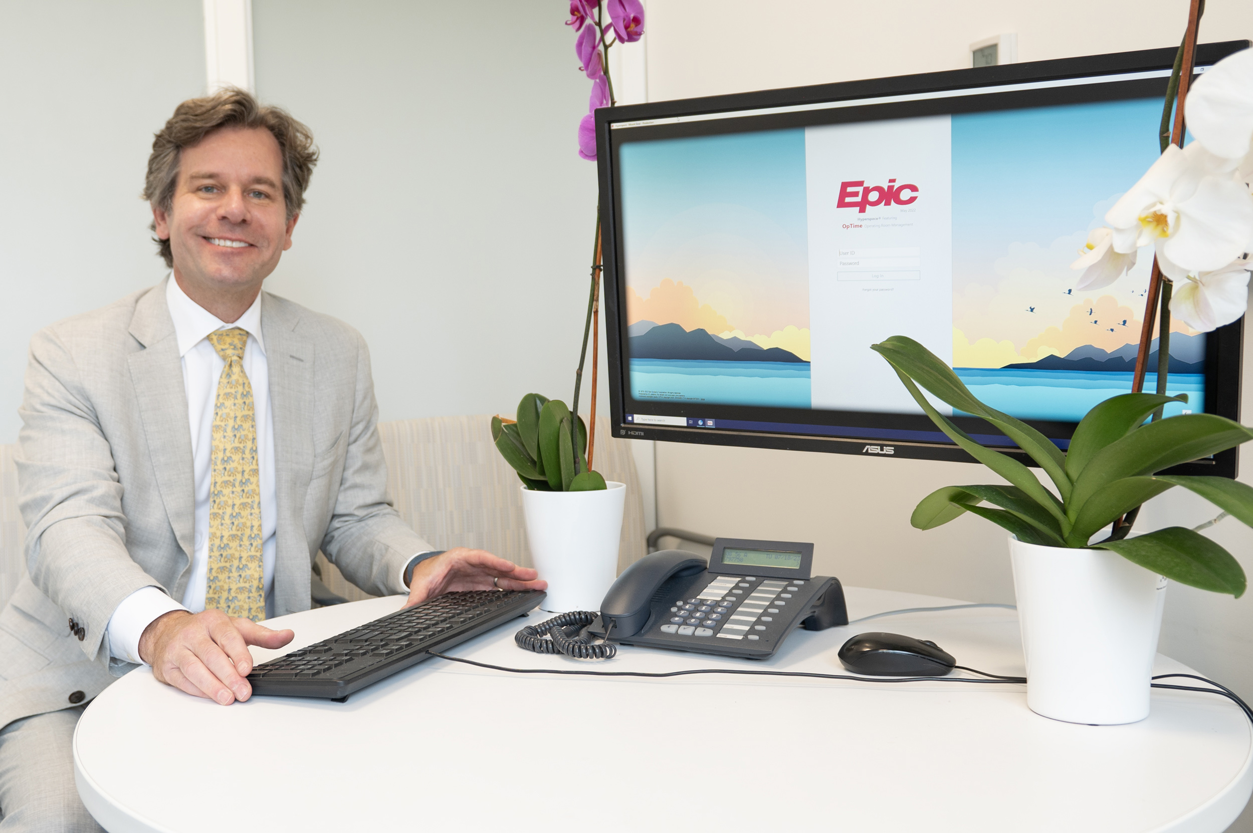 Dr. Belsley in front of the electronic medical record