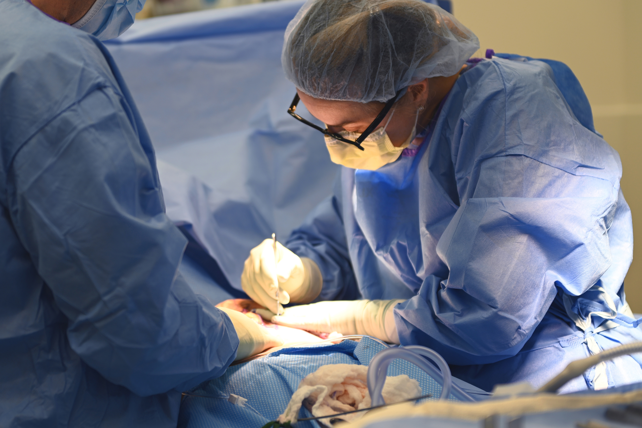 Ksenija Belsley, MD performing a breast reduction surgery